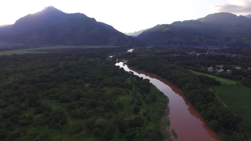 Dusk River Ariel Shot with Mountainous Background