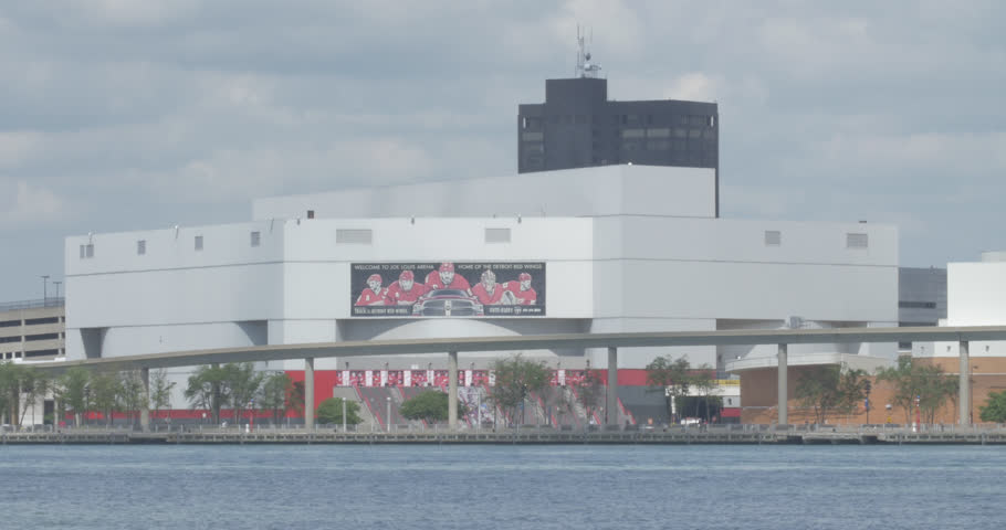 Joe Louis Arena on the Detroit River on a sunny day before game time.