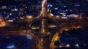Aerial night video of ring road passing through city center