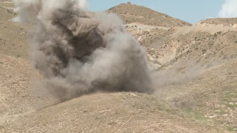 Afghanistan - February 16, 2008: A small explosion in the afghan mountains
