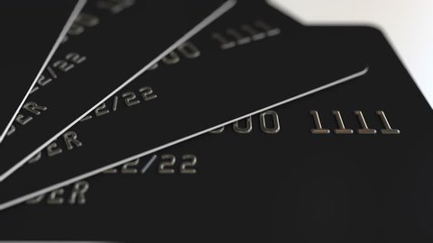 Black plastic credit cards, loopable animation Stock-video