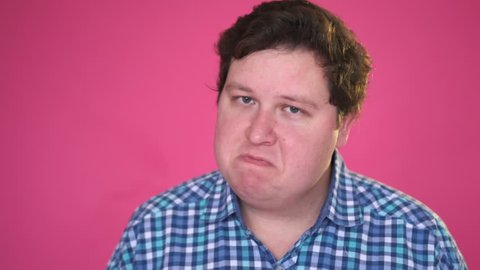 Shaking Head to reject, no by man, Isolated on Pink Background