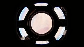 Planet Earth seen from the ISS. Earth as seen through window of International Space Station ISS . Earth through the porthole of the ISS. Elements of this video furnished by NASA.