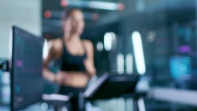 In Scientific Sports Laboratory Beautiful Woman Athlete Runs on a Treadmill with Electrodes Attached to Her Body, Monitors Show EKG Data on Display. Slow Motion. Out of Focus. Shot on RED EPIC-W 8K. - Powered by Shutterstock - Get 15% off with code: PIKWIZARD15