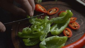 Sweet pepper and chili on a cutting board. Video