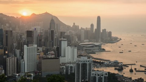 Top view of skyscrapers in downtown of Hong Kong at sunset. Time Lapse.