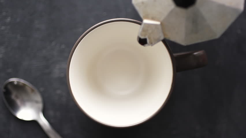 Super slow motion top view of coffee pour into cup from geyser coffee maker | Shutterstock HD Video #1007635717