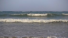 Wave breaks on sandy beach 16x slow motion 480 fps, full hd 1080p video clip