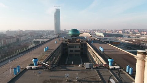 Aerial drone footage view of Lingotto overhead track in Torino Piemonte Italy sunset // no video editing