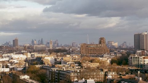 Rising aerial establishing shot of Kensington, Hyde Park and London cityscape