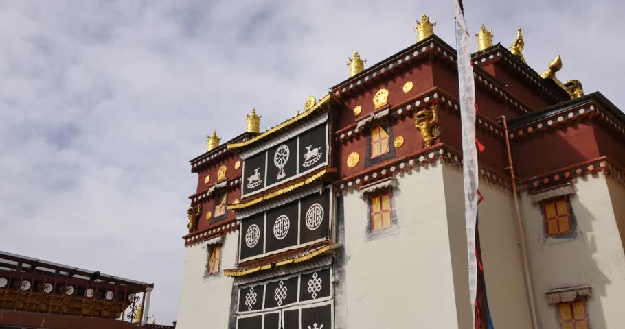 Songzanlin Monastery with prayer flags in Shangri-La, Yunnan, China. (4K)