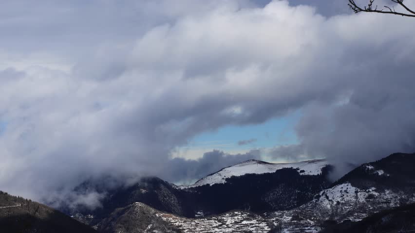 Stormy clouds moving over Pyrenean mountain in Aude, Occitanie in south of France