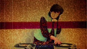 the coolest grandma ever, older woman djing and partying in a disco setting. this version has overlayed video distortion and glitch effects