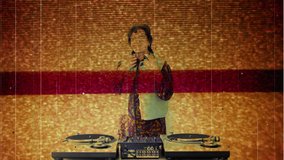the coolest grandma ever, older woman djing and partying in a disco setting. this version has overlayed video distortion and glitch effects