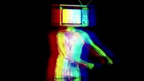 Slow motion of man with television covering face doing the floss dance wearing sparkly costume against black background