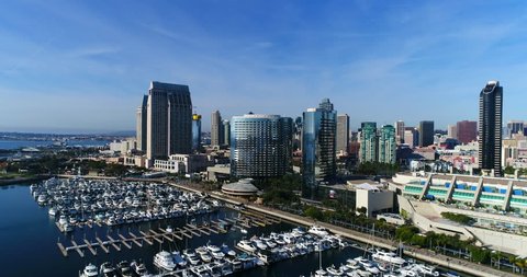Aerial Drone video flying over the Downtown San Diego Marina with the Embarcadero and the San Diego Skyline. in the background. 