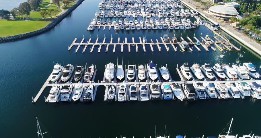Aerial Drone video flying over the boats in the Downtown San Diego Marina towards the Embarcadero. San Diego, California. 