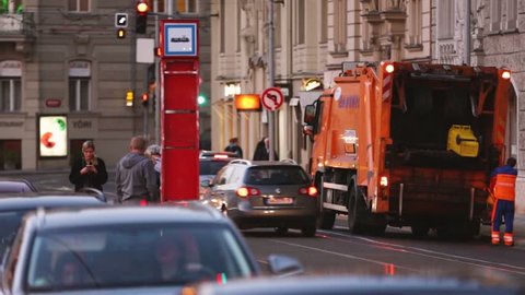 Prague, Czech Republic - September 22, 2017: Automated Garbage Truck Working In Evening Street. Dustcart, Trash Truck, Rubbish Truck, Junk Truck, Dumpster Specially Designed To Collect Municipal Waste