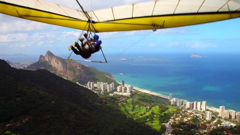 Hangglider taking off from the ramp at Pedra Bonita, in the Tijuca National Forest, heading toward the beach at São Conrado in Rio de Janeiro, Brazil