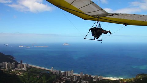 Hangglider taking off from the ramp at Pedra Bonita, in the Tijuca National Forest, heading toward the beach at São Conrado in Rio de Janeiro, Brazil