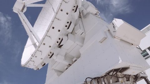 SAN PEDRO DE ATACAMA, CHILE - DECEMBER 3th 2017: Radio telescope antenna in maintenance at the ALMA control center, during a free visit to the ALMA building.