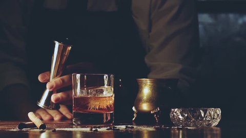 Barman make a cocktail