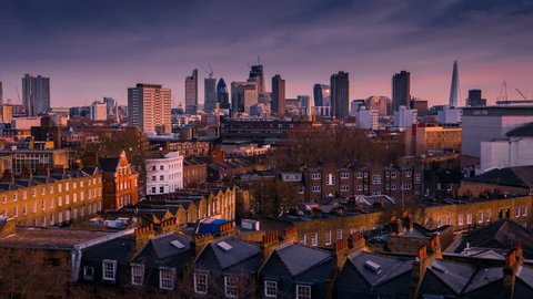 Wide angle day to night timelapse of the London City skyline, the financial heart of London, England, UK, including the Shard, the Gherkin and contrasting Victorian houses in the foreground