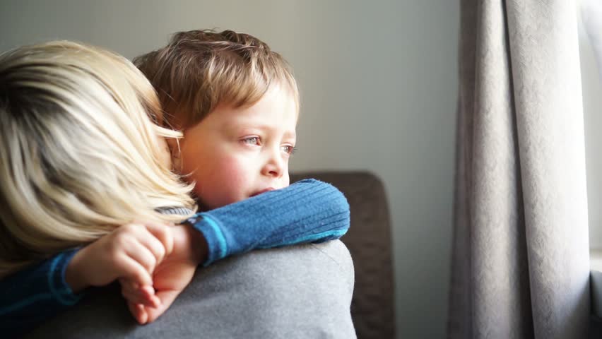 Upset little boy hugging his mother at home | Shutterstock HD Video #1007738809