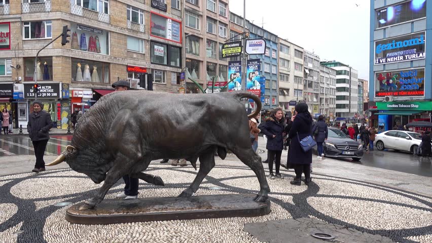 Kadikoy, Istanbul, Turkey - 16th of January 2018: 4K Famous Kadikoy Bull statue in Istanbul, rainy day