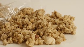 Close-up of opened dehydrated crunchy cereals 4K 2160p 30fps UltraHD footage - Tilting over muesli with flavor of hazelnuts 3840X2160 UHD video