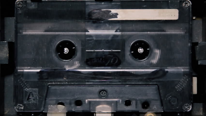 spinning cassette tape playing music on Stock Footage Video (100% ...