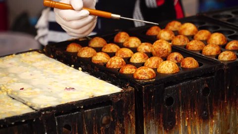 How to making Japanese food : Takoyaki. Japanese snack made of a wheat flour-based batter and cooked in a special molded pan. It is typically filled with minced or diced octopus, tempura scraps.