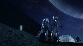 Two Astronauts in Space Suits Stand on the Moon Looking at the Beautiful Earth. In the Background Lunar Base with Geodesic Dome. Moon Colonization and Space Travel Concept. Shot on RED EPIC-W 8K. - Powered by Shutterstock - Get 15% off with code: PIKWIZARD15