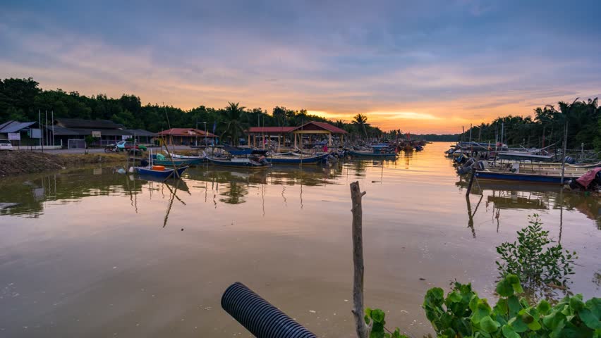 Timelaps. Beautiful moving clouds and sunset moment at fisherman jetty, Kelanang, Malaysia