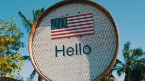 Beautiful sign with American flag with the inscription Hello in English. Sign with the word hello - Powered by Shutterstock - Get 15% off with code: PIKWIZARD15