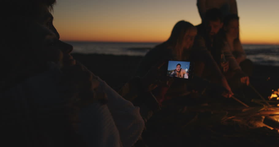 Boy Shows Girl A Picture On His Phone. Shot on RED Helium 8K