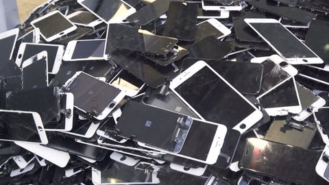 Prague, CZ 21 February 2018: A heap with the Apple iPhone broken screens  lying one on top of another. Devices are prepared for utilization. 
Editorial