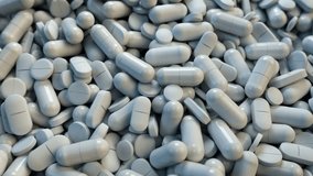 3D CGI video of camera slowly moving over heaps of pills, tablets and medicines
