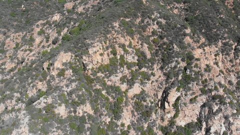 Quick Flying Drone Shot Flying Backwards Over the San Gabriel Mountains and Over a Popular Hiking Destination at Echo Mountain in Altadena, Pasadena, Los Angeles, California