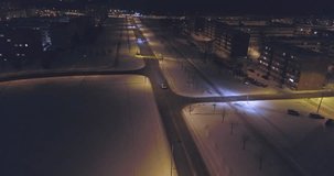 Camera follows cars, on the road at night. Aerial footage. An amazing aerial view of Kohtla-Jarve City at night, Estonia.