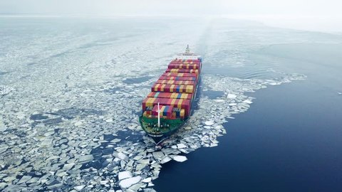 Aerial view of container ship in the sea at winter time