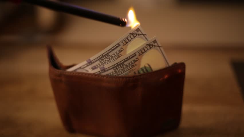 Burning through money in your wallet Royalty-Free Stock Footage #1007798710