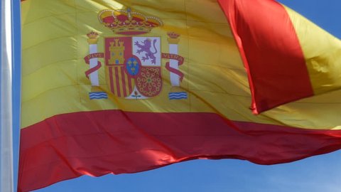 flag of Spain waving in the Plaza de Colón in Madrid, Spain. Filmed on February 20, 2018.