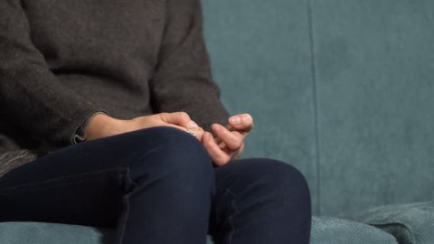 nervous and stressed woman on psycholigist couch during a session