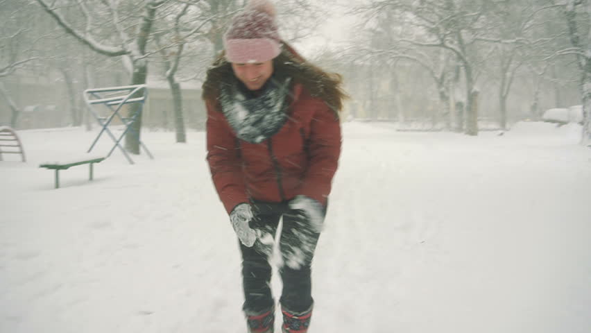 young women enjoying winter day outdoors. snow winter dream. slow motion
