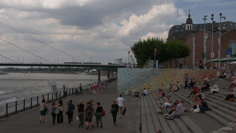 DUSSELDORF - circa 2017: Rhine promenade on in Dusseldorf, Germany. In 1998 the Dusseldorf Rhine promenade was awarded as the best example of urban planning in Germany.ULTRA HD 4K, real tim