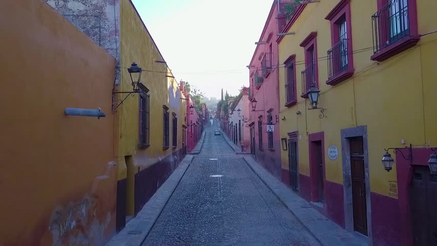 tour through one of the magical streets of San Miguel de Allende on a quiet morning with few people on the street Royalty-Free Stock Footage #1007811646