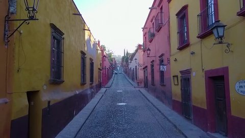 tour through one of the magical streets of San Miguel de Allende on a quiet morning with few people on the street