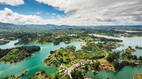 Medellin, Colombia, time lapse view of Guatape from the Rock (La Piedra del Penol) during daytime. Zoom in.