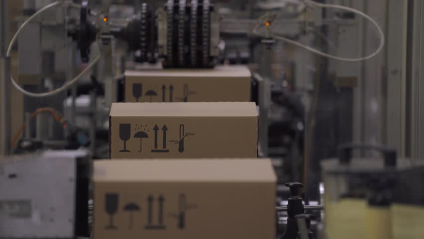 Warehouse, cardboard box is moving along the production line. Royalty-Free Stock Footage #1007825980